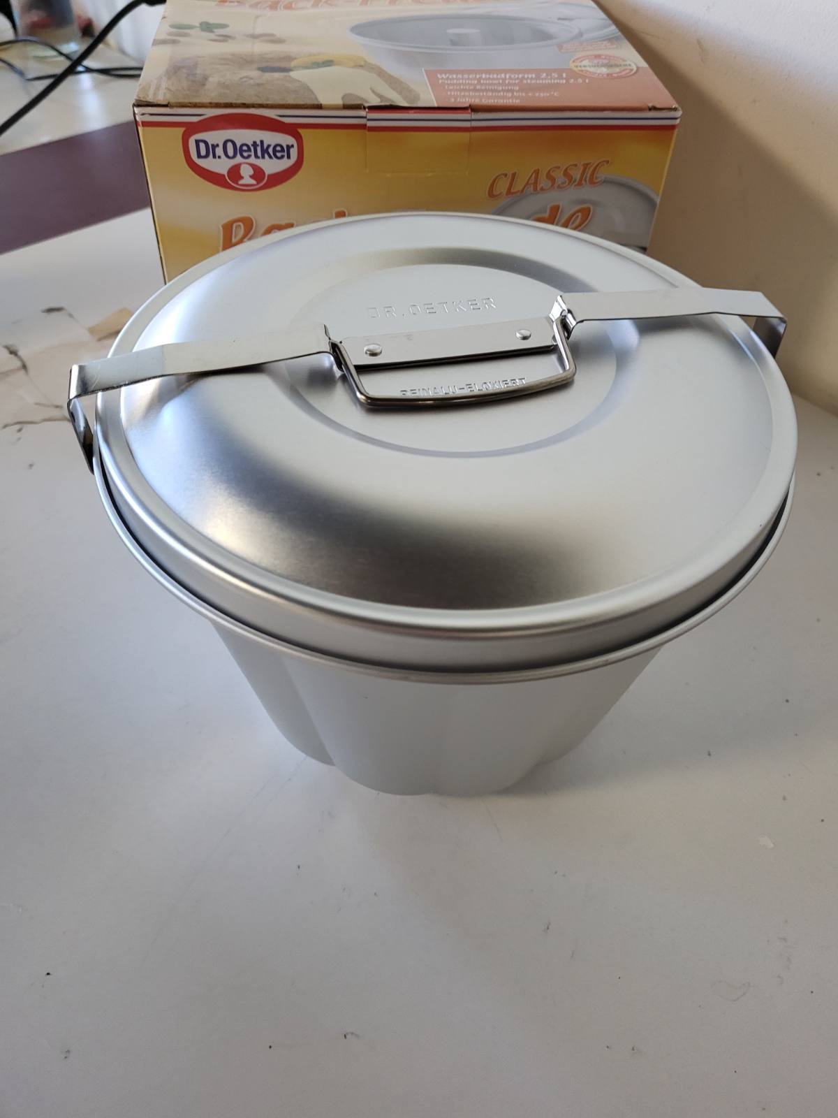 217526 - DR. OETKER Formë alumini për banjë me ujë Ø 21 cm, kapacitet 2.5 litra, argjend