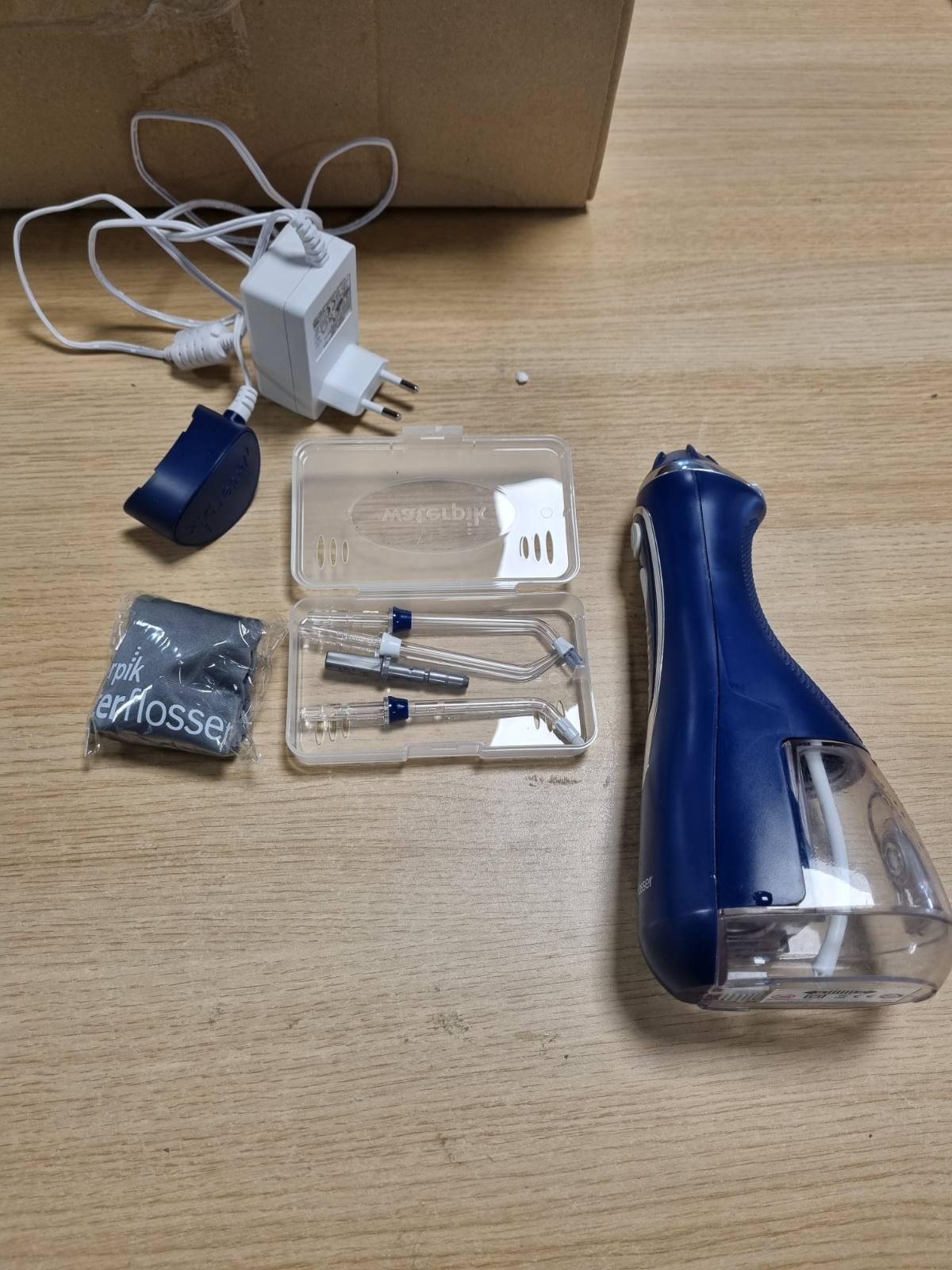 271092 - WATERPIK Pastrues uji portativ pa tel Advanced, 3 cilësime presioni, bateri e rikarikueshme, blu (WP-563EU)