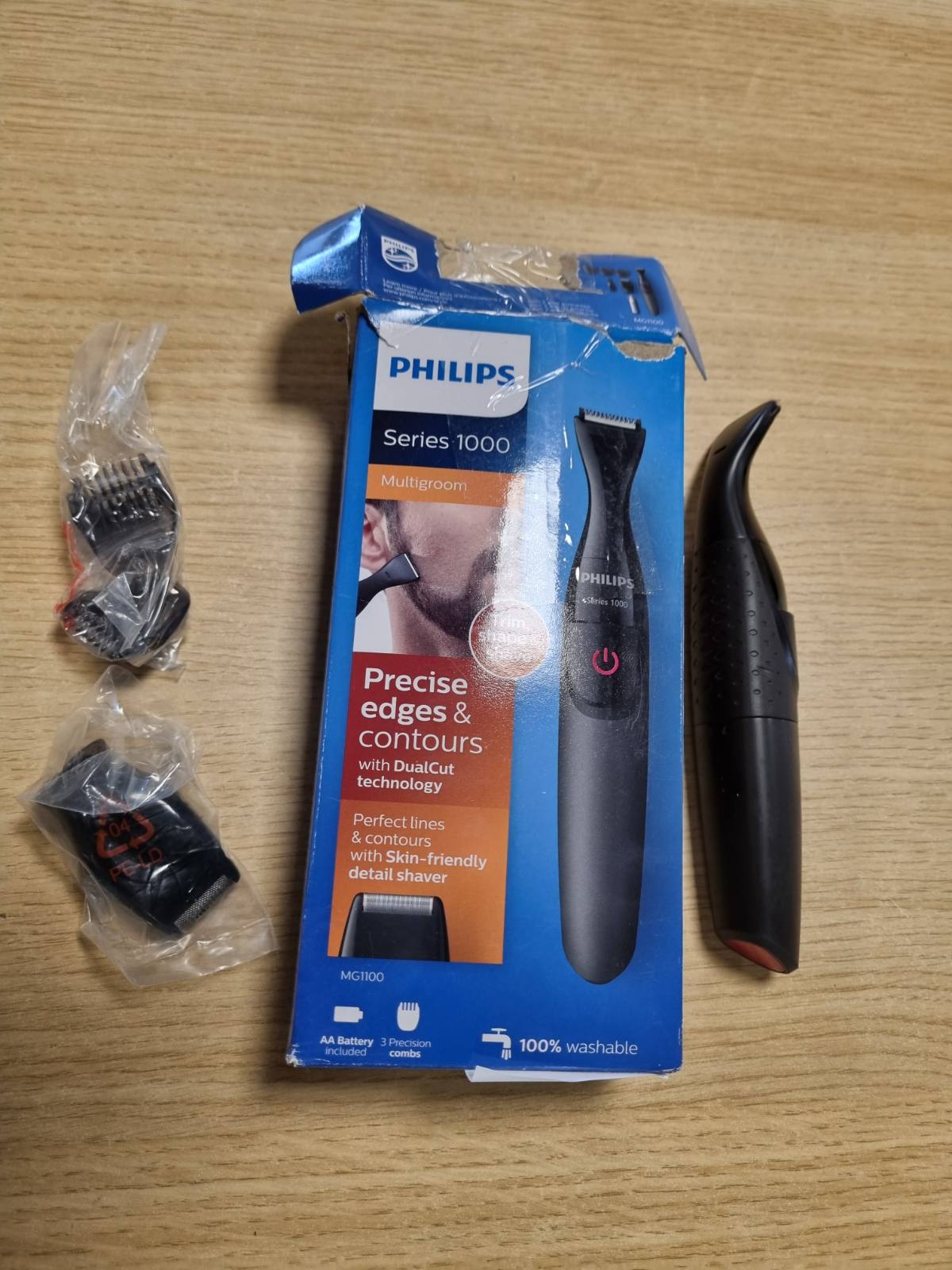 275469 - PHILIPS Makinë prerëse shumëfunksionale Seria 1000 me 2 krehëra preciz, e zezë, modeli MG1100/16