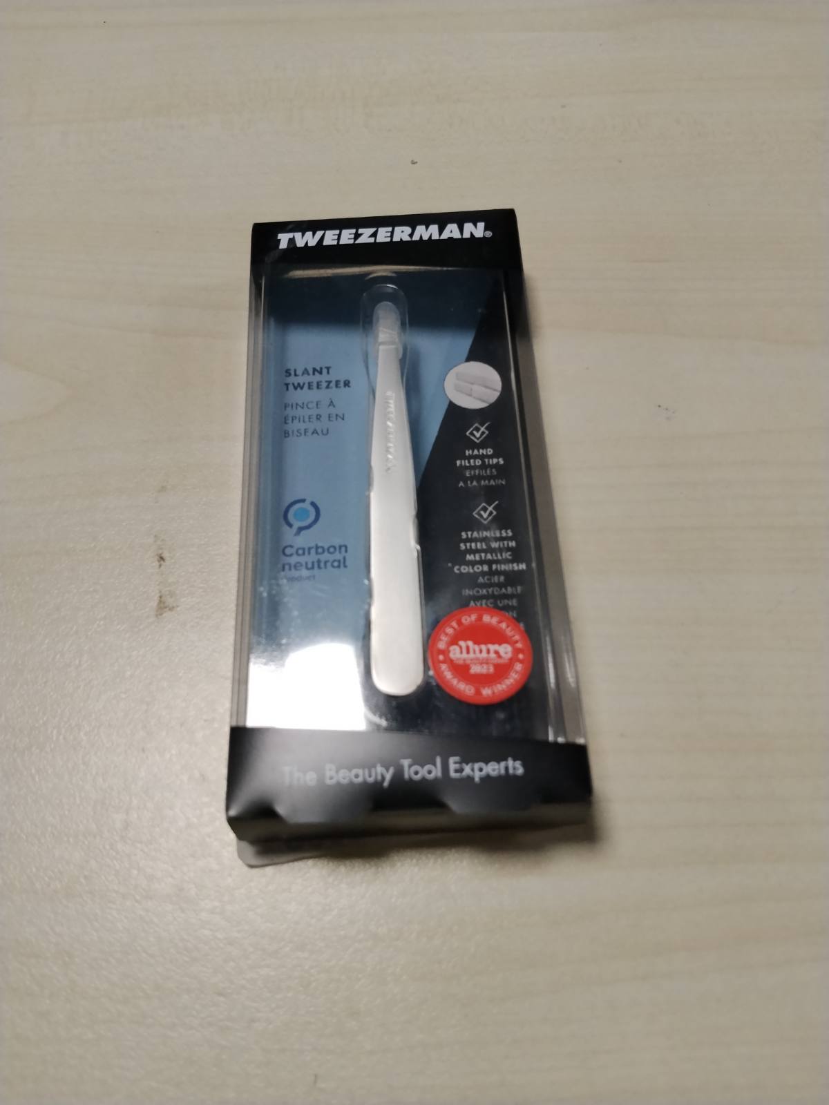 321393 - TWEEZERMAN Pinceta (të bluara me dorë, me majë të pjerrët, për heqjen e vetullave, çelik inox), Argjend Platini
