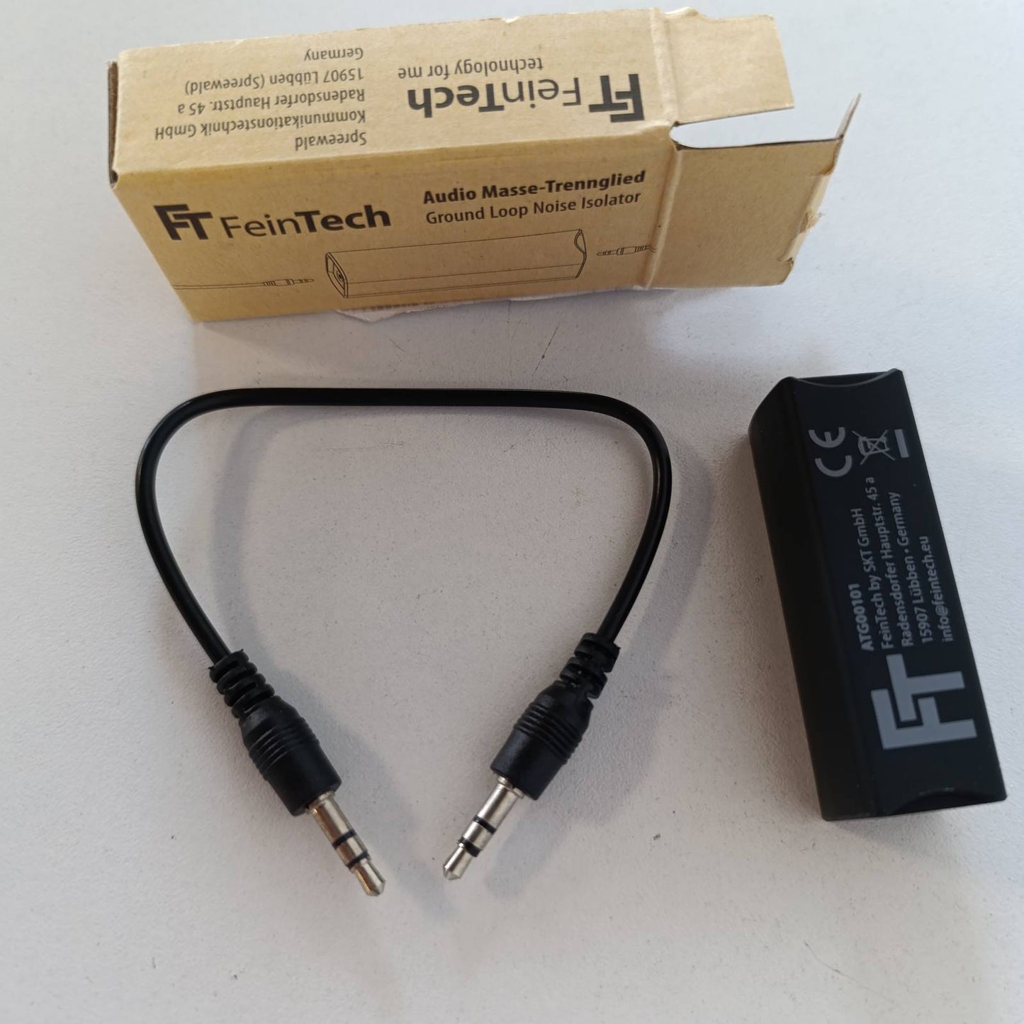 320465 - FEINTECH Ndarës tokëzimi audio ATG00101, filtër rryme manteli, prizë jack 3.5 mm, eliminon zhurmën