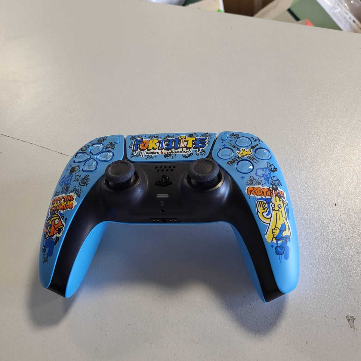 319367 - Playstation DualSense® Kontrolluesi pa tel – FORTNITE® Edition i kufizuar