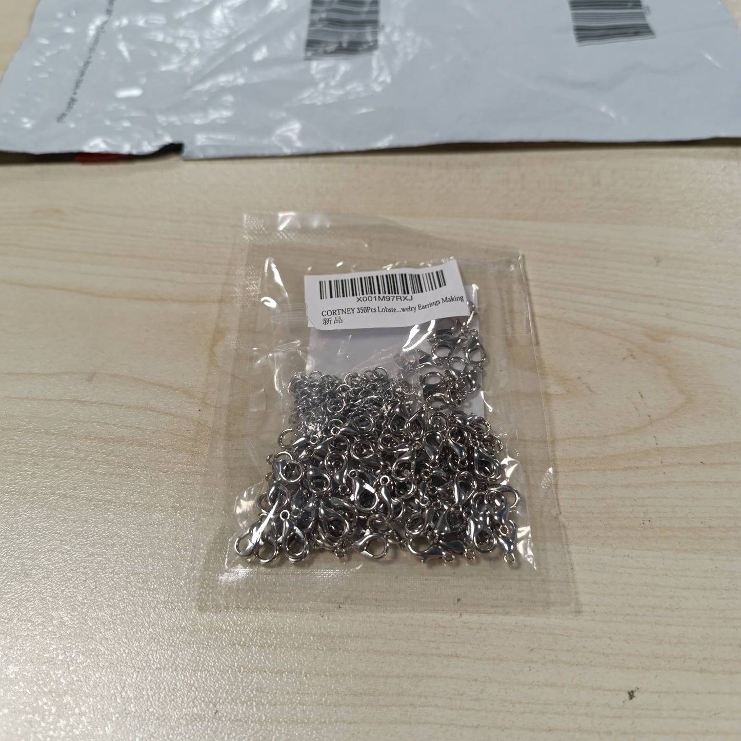 274598 - CORTNEY Kapëse karavidheje me 100 copë, 250 copë unaza kërcimi të hapura prej çeliku inox