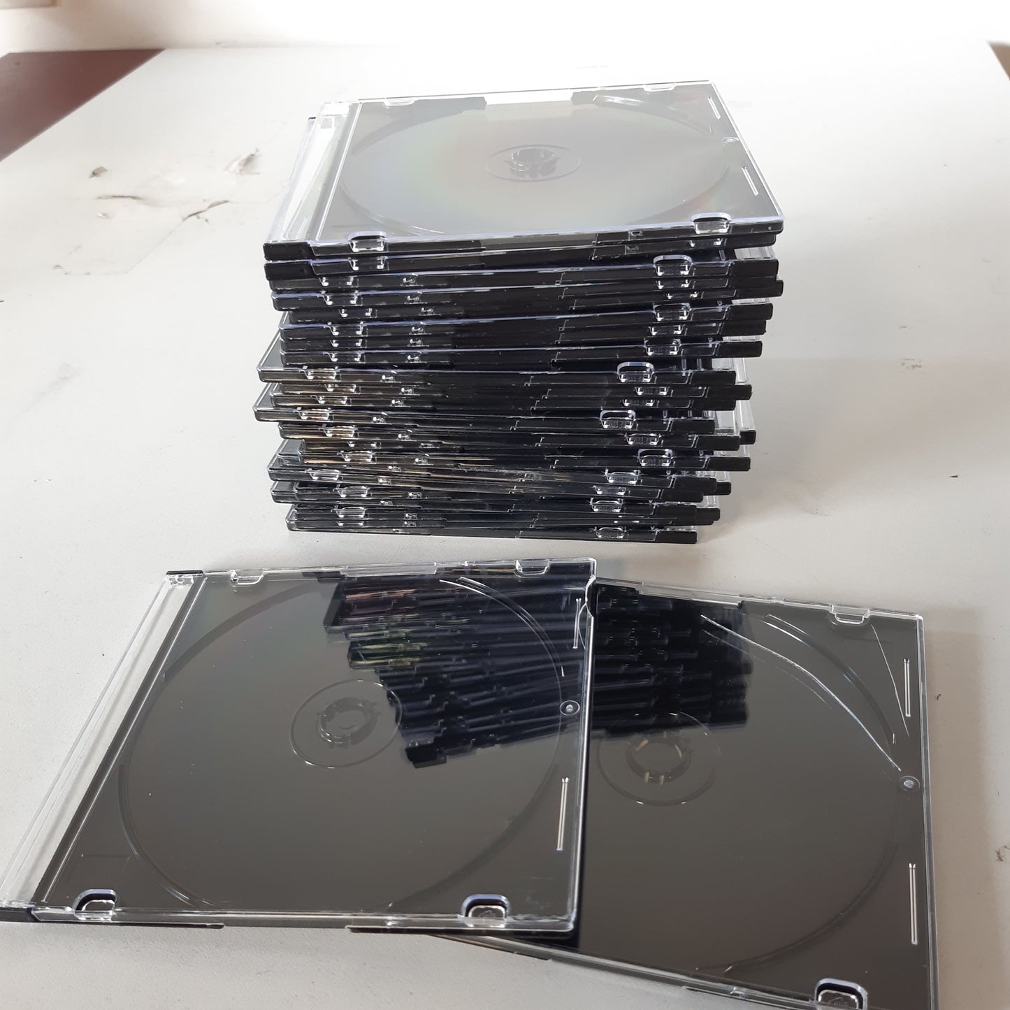257173 - HAMA Kutia e hollë për CD, ngjyrë e zezë/transparente, pako me 25 copë