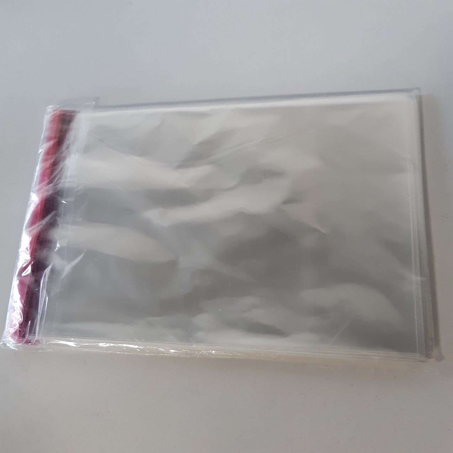 248736 - Qese të sheshta Netuno 100 PP transparente të mëdha 17.2 x 24 cm, qese vetëngjitëse të vogla, qese prej folie Peel & Seal, qese celofani të bëra nga plastikë transparente