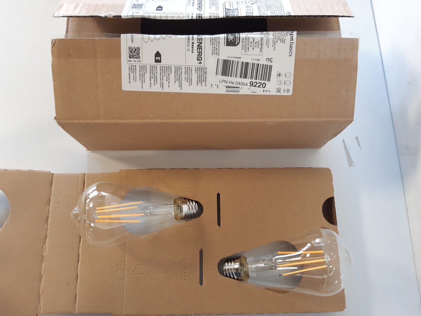 202637 - AMAZON BASICS Pako me Llamba LED Vintage Edison, Baza E27 ST64, 7W (Ekuivalenti i 60W), 2 Copë, Filament Transparent, pa Errësim