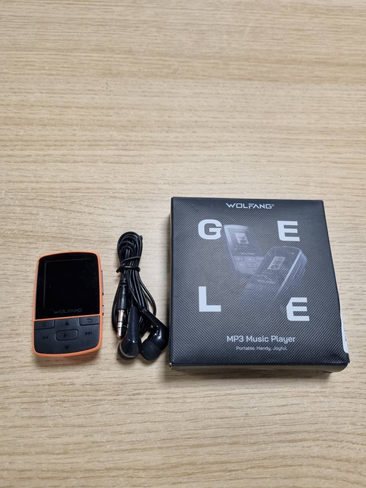 273397 - WOLFANG MP3 PLAYER me Bluetooth 5.2, Sport Clip, Madhësi Mini, Pesha 28.3 g, Radio FM HiF, Regjistrues Zëri, Kufje të Përfshira, Portokalli