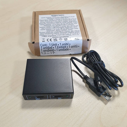 274162 - Amazon Basics Ndarës HDMI, 1 Hyrje/2 Dalje, 4K në 30Hz për 2 Monitorë, Kabllo USB/USB-A në DC 1m i Përfshirë, i Zi