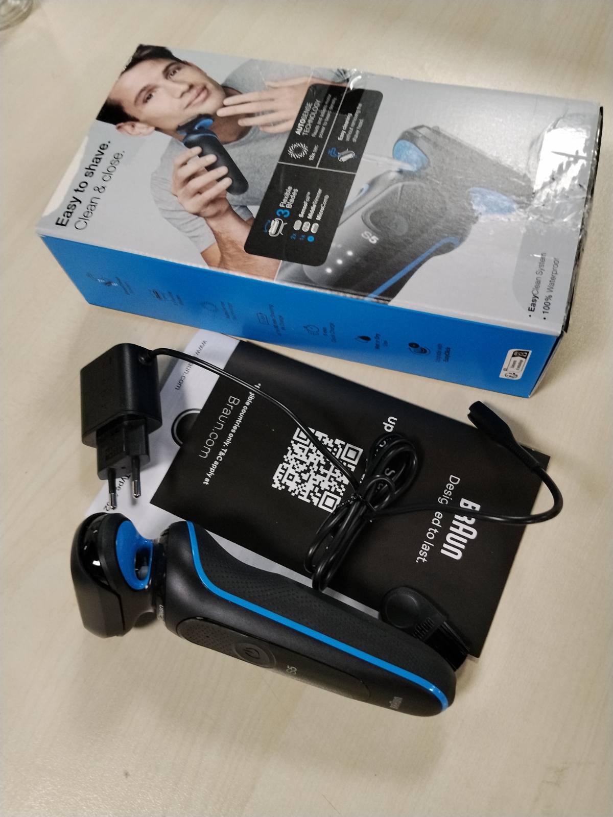 315366 - inë rroje elektrike Seria 5, 51-B1000s, Blu, pa tel, prerëse mjekre, bateri 50-minutëshe, rezistente ndaj ujit, 1 aksesor
