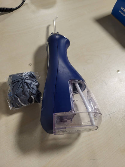 315502 - WATERPIK Pastrues uji pa tel Advanced, 3 cilësime presioni, karikues USB, ideal për udhëtime, model WP-583EU