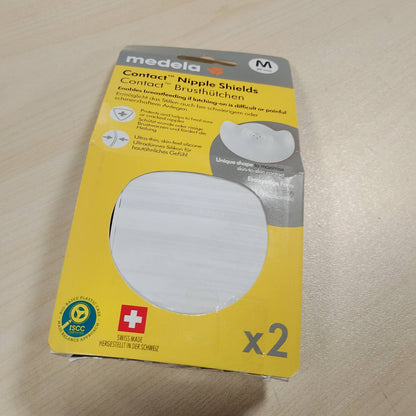 318594 - MEDELA Mbrojtëse për gjoksin Contact, Silikoni, Dizajn i butë, Pa BPA, 1 pako me 2 mburoja (20 mm), Kuti ruajtjeje
