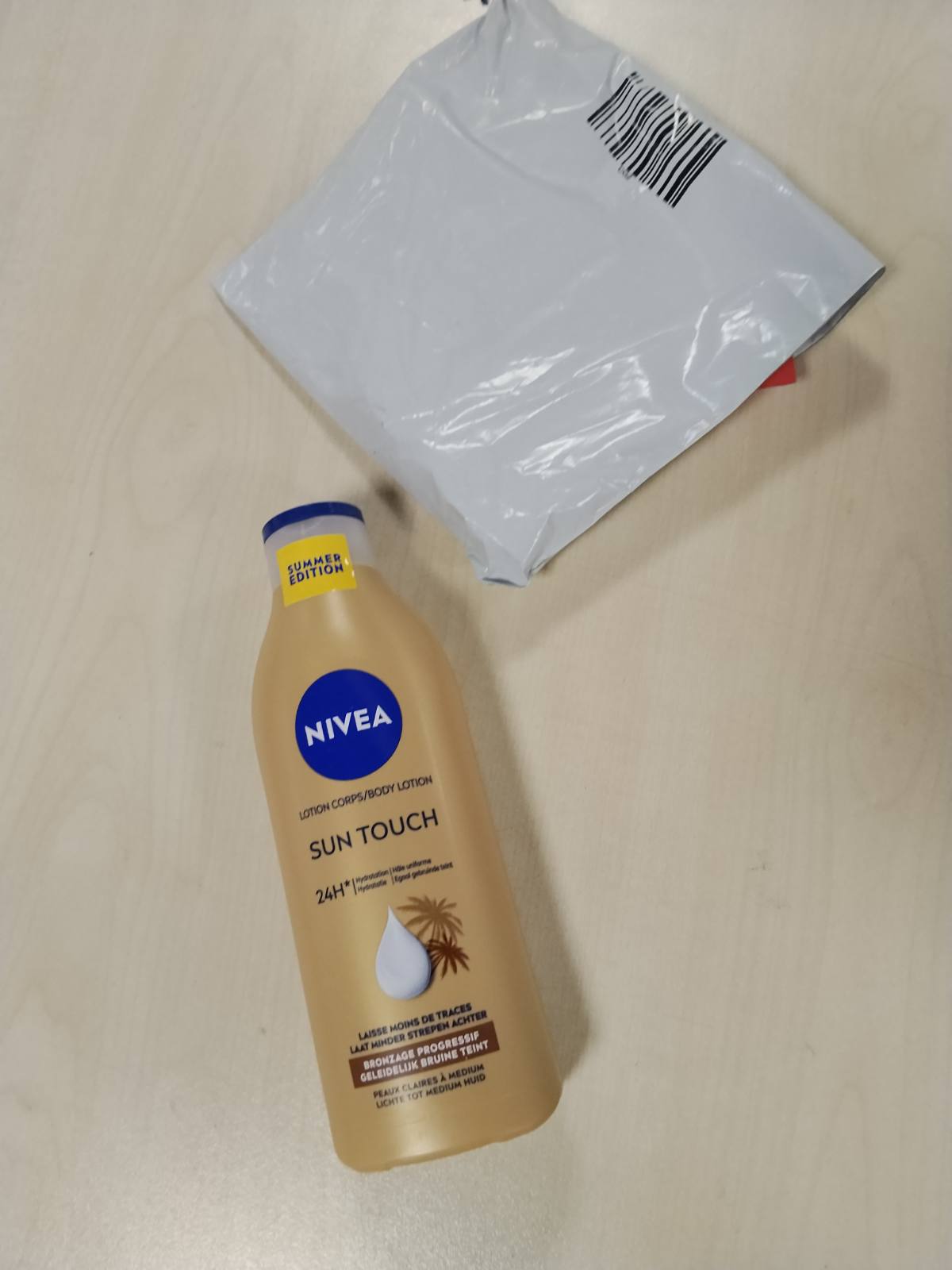 321714 - NIVEA Locion trupi Sun Touch - Nxirje e njëtrajtshme - Locion hidratues - Vaj ginkgo biloba dhe fara rrushi - Nxirje pa diell - 400 ml