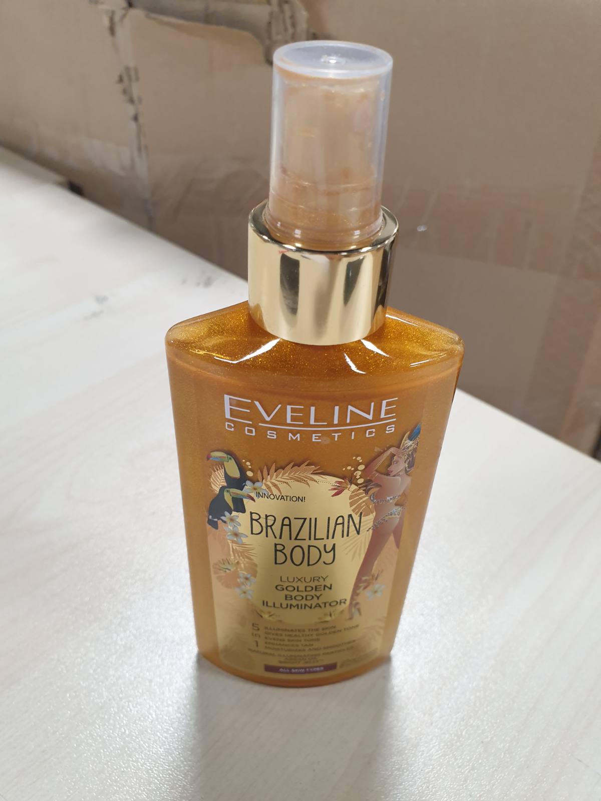 322000 - EVELINE COSMETICS Ndriçues trupi Brazilian Body Luxurious Golden, Hidraton dhe barazon ngjyrën e lëkurës, 200ml