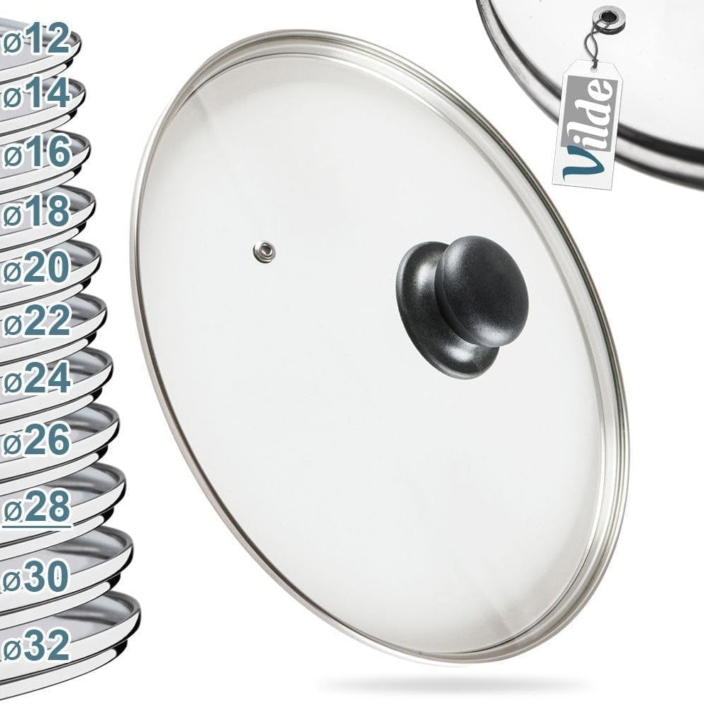 254325 - VILDE Kapak qelqi universal 28 cm - Rezistent ndaj nxehtësisë deri në 200°C - Rrip çeliku inox në ngjyrë argjendi dhe dorezë plastike - Për tenxhere, tiganë dhe tava - Me kanal avulli - Sistem transparent shikimi