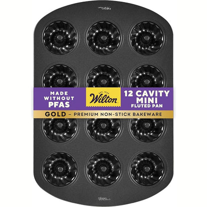 141602 - Wilton Gold – Tavë pjekjeje prej çeliku inox me shtresë kundër ngjitjes, me 12 zgavra për mini kekë me formë të valëzuar, pa PFAS, paketimi mund të ndryshojë