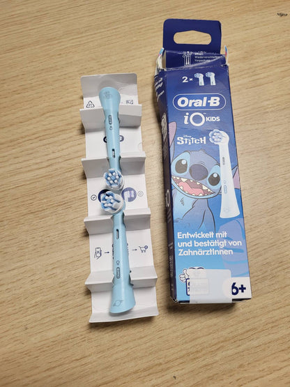 289959 - ORAL-B Koka Furçash Zëvendësuese iO për Fëmijë 6+ Disney Stitch, Blu, Pako me 2 copë