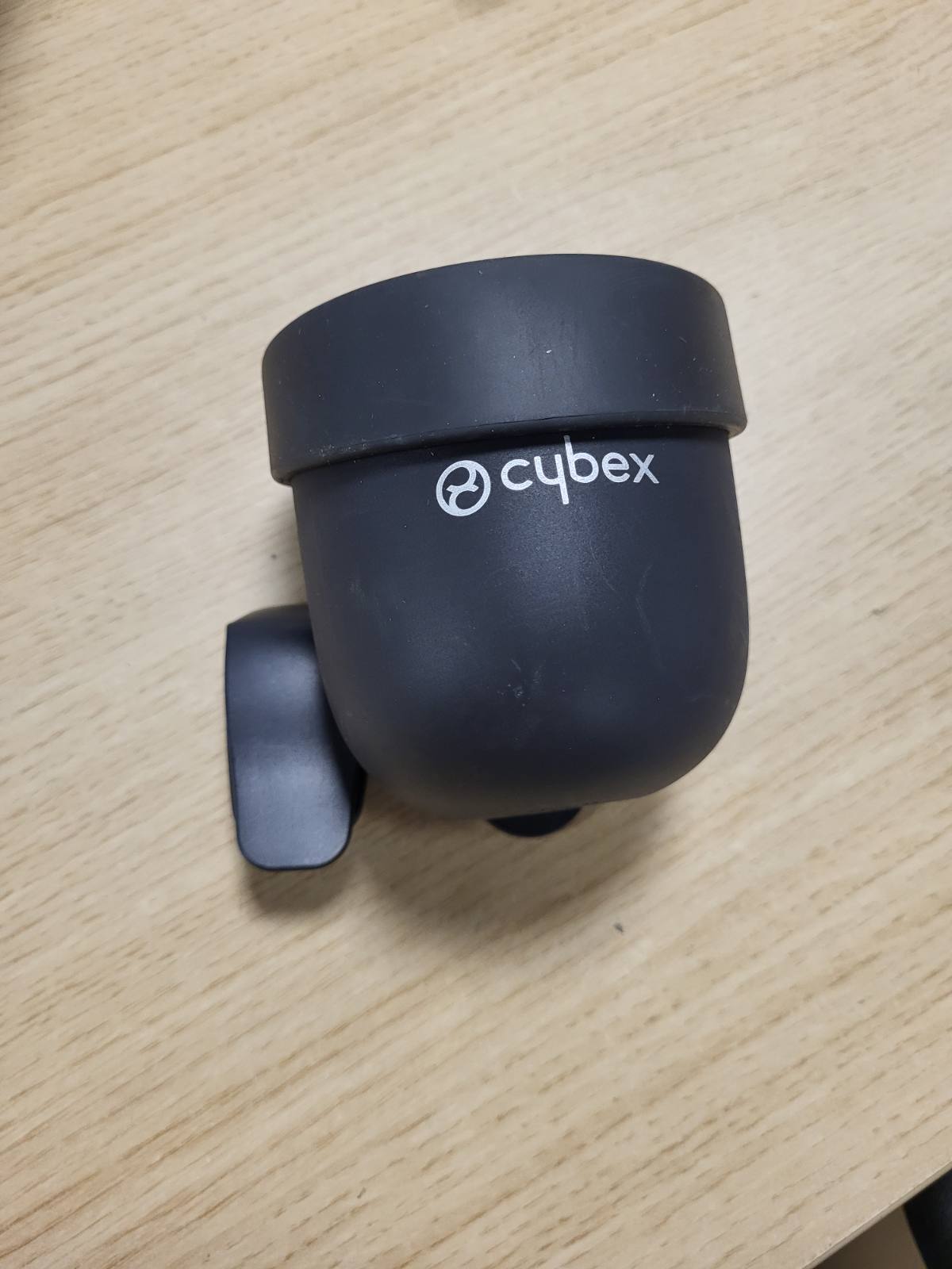 313557 - MBAJTËSE GOTASH CYBEX - për sediljet e makinave për fëmijë, e zezë