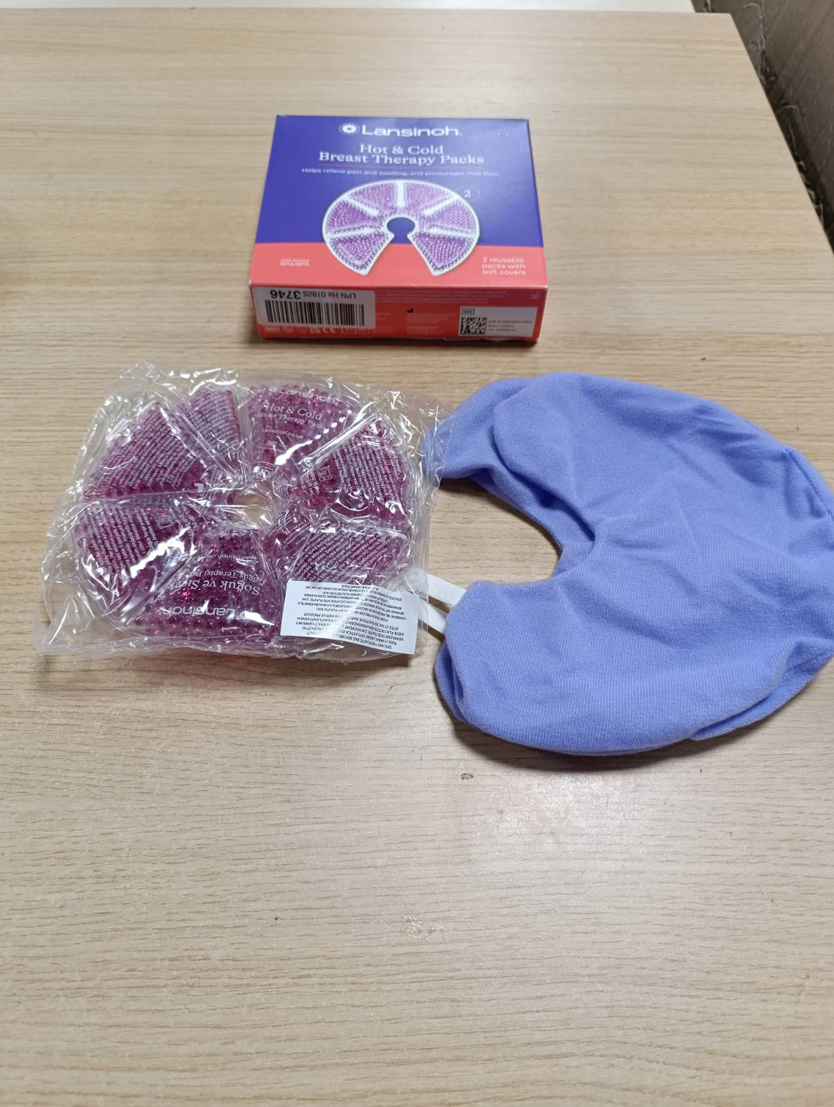 317599 - LANSINOH Kompresa gjiri të nxehta/të ftohta, 2 copë, me mbulesë mbrojtëse prej leshi, formë anatomike