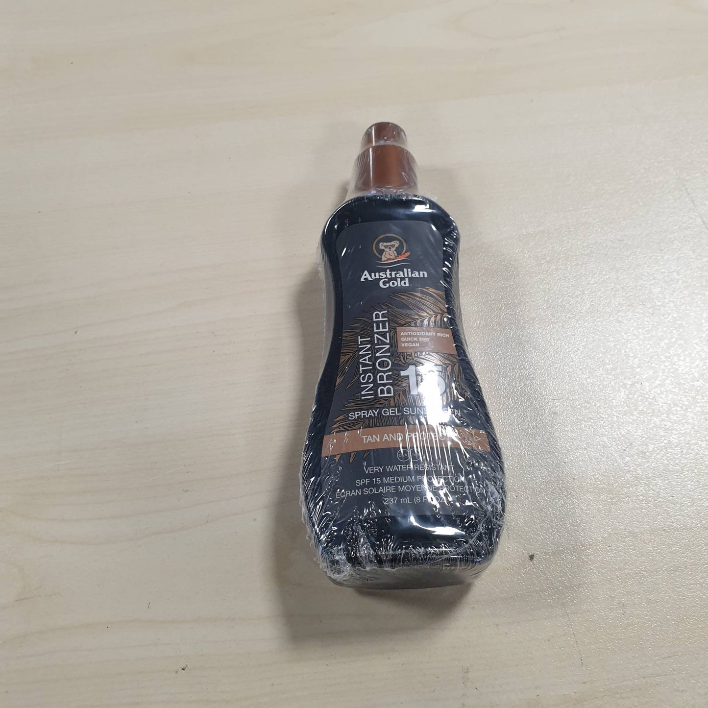 317038 - AUSTRALIAN GOLD Sprej mbrojtës nga dielli me bronzues SPF 15, 237 ml