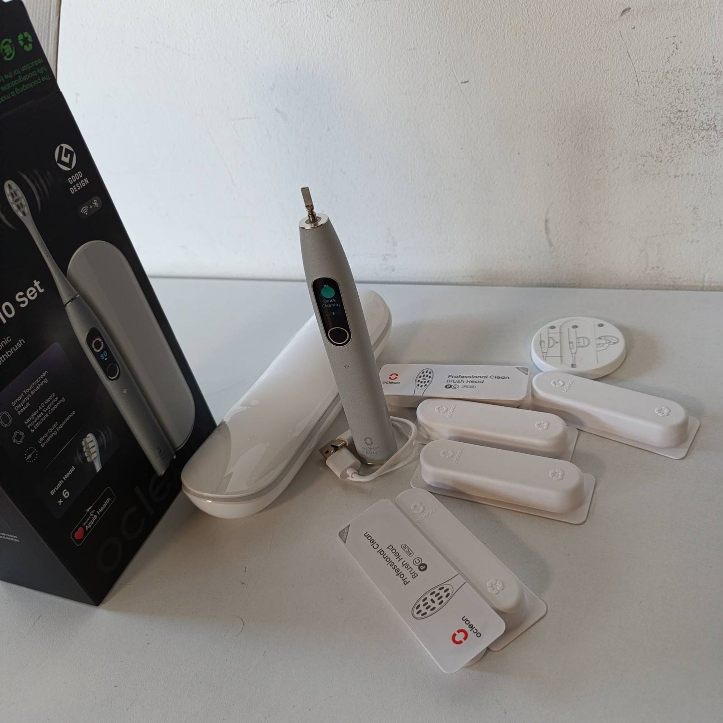 315159 - rçë dhëmbësh elektrike X Elite 10, 12 zona gjurmimi, 5 mënyra kujdesi, 6 koka furçe, kuti udhëtimi, jetëgjatësi baterie 40-ditore, 45 dB, set gri