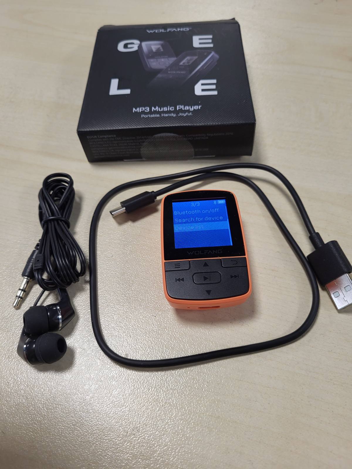 273401 - WOLFANG MP3 PLAYER me Bluetooth 5.2, Sport Clip, Madhësi Mini, Pesha 28.3 g, Radio FM HiF, Regjistrues Zëri, Kufje të Përfshira, Portokalli