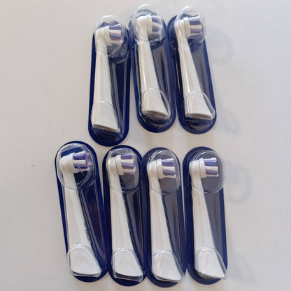 302787 - ORAL-B Koka Zëvendësuese iO Radiant White, 7 Koka të Rrumbullakëta të Bardha, Qime të Kënduara dhe Qime Lustruese