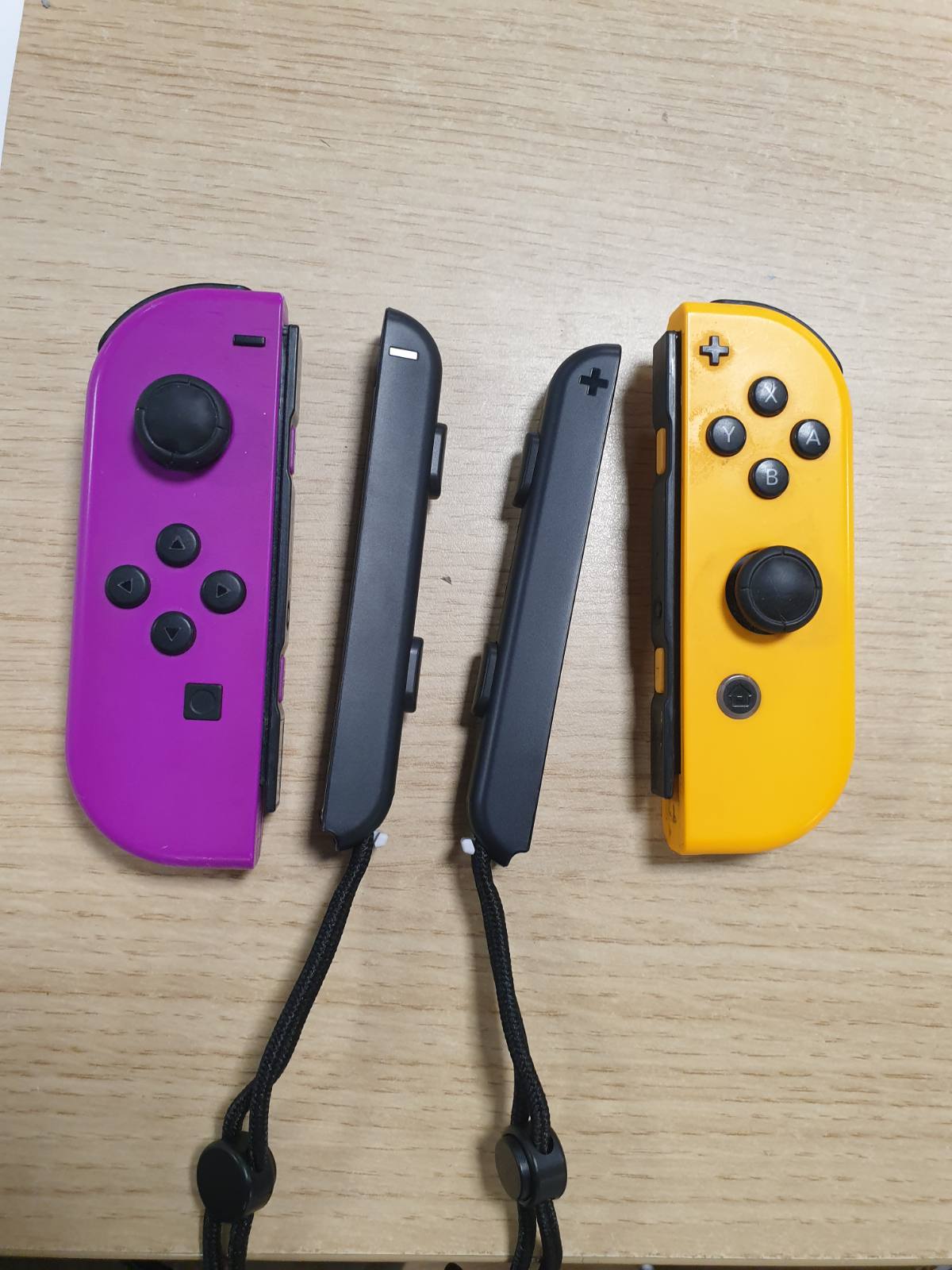 295606 - NINTENDO Palë kontrolluesish Joy-Con - Majtas Neon Vjollcë/Djathtas Neon Portokalli [lojë video]