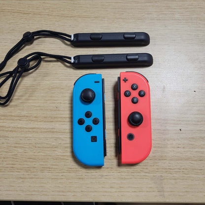 308707 - NINTENDO Switch - Kontrollues Joy-Con Neon-Rot / Neon-Blau (Set 2er)