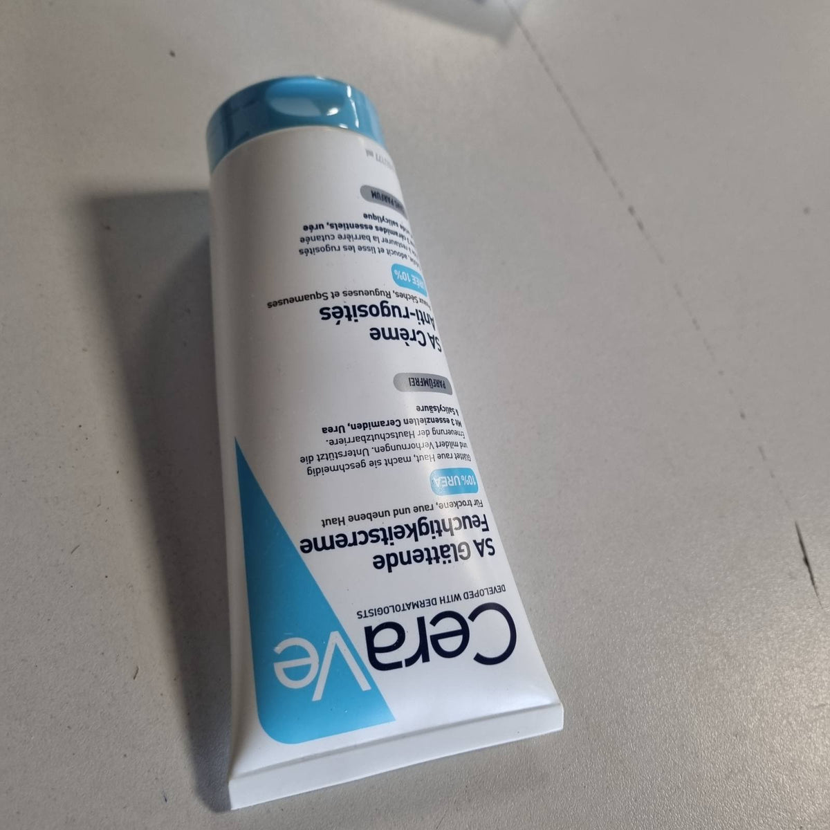303404 - CERAVE SA Urea Krem hidratues zbutës për fytyrën dhe trupin, 177 ml