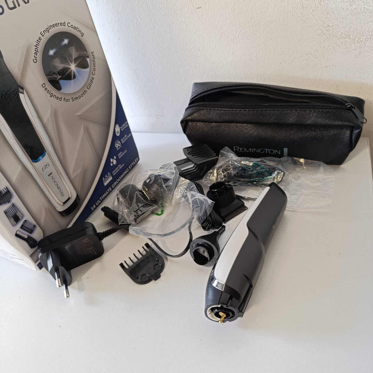 289690 - REMINGTON Makinë prerëse flokësh dhe prerëse mjekre shumëfunksionale [Lithium G5] - Përfshin 9 prerëse flokësh dhe krehëra, PG5000, e zezë