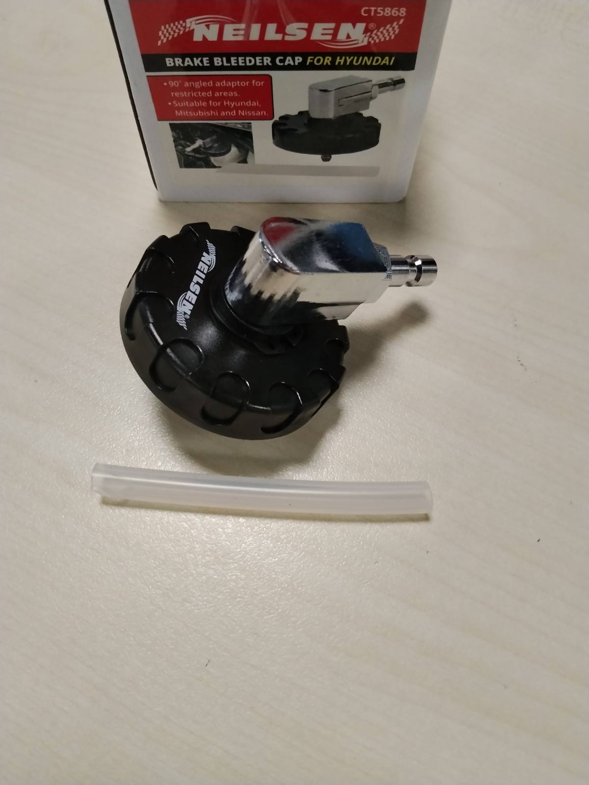 314904 - NEILSEN Kapaku i shkarkimit të frenave CT5868 me përshtatës 90° – I pajtueshëm me Hyundai, Kia, Mitsubishi dhe Nissan – Kapaku origjinal 58531 07000