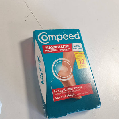 318428 - COMPEED - Fasha për flluska Medium - Fasha hidrokolloide - me mbushje në thembër, mbron nga presioni dhe fërkimi - lehtëson dhimbjen, për shërim të shpejtë - 4.2 x 6.8 cm - 12 copë