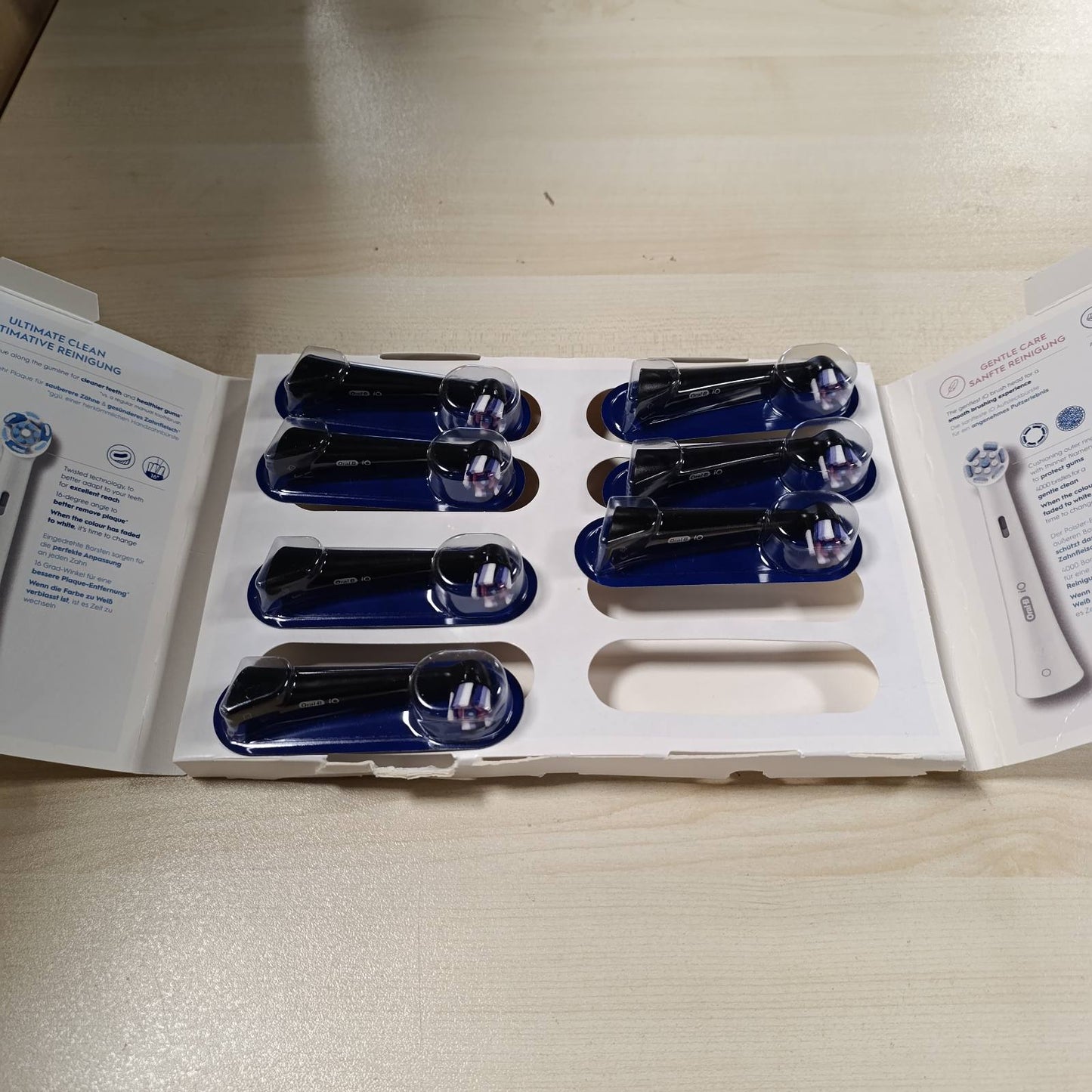 271109 - ORAL-B Koka Zëvendësuese iO Radiant White, të Zeza, 8 Mbushëse, Qime Origjinale të Rrumbullakëta, për pastrim dhëmbësh