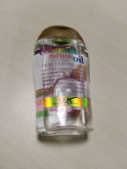 312332 - OGX Dëmtim Remedy + Vaj Mrekullie Kokosi, 100 ml, vaj riparues për flokët