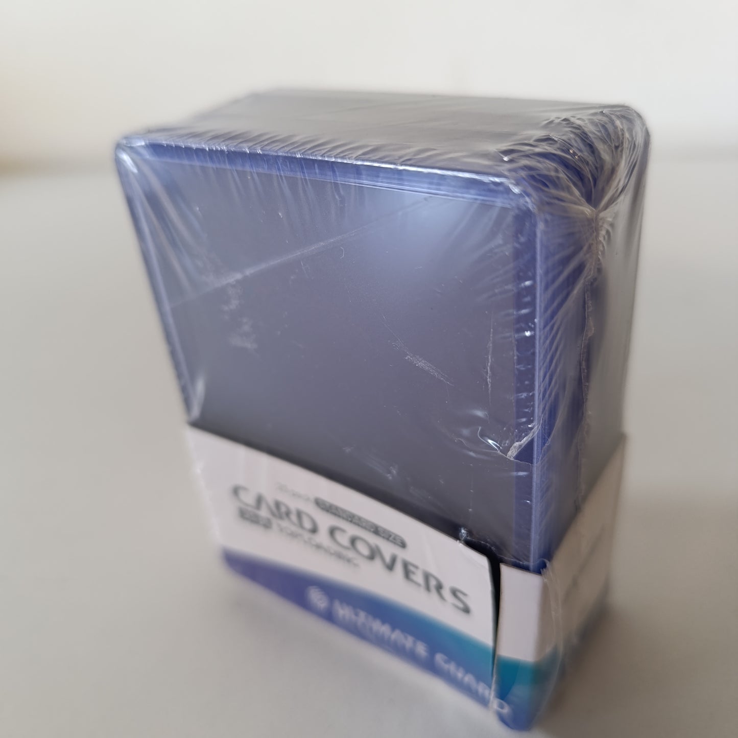 269610 - ULTIMATE GUARD Mbulesa Kartash me Ngarkim nga Sipër, Transparente 35 pt, Pako me 25 copë