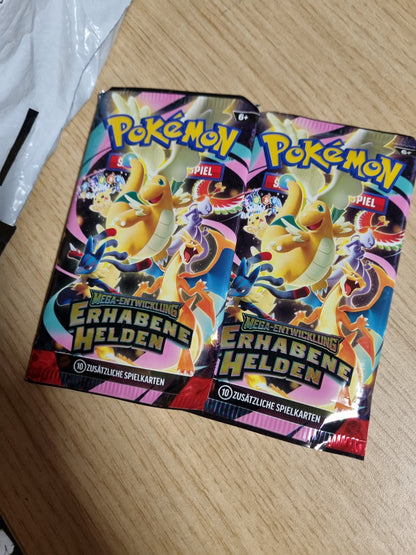 141608 - Pokémon – Loja e Kartave Tregtare: Koleksioni Mega Development – Sublime Heroes: Erika (1 kartë promo holografike, 1 monedhë dhe 2 pako booster)