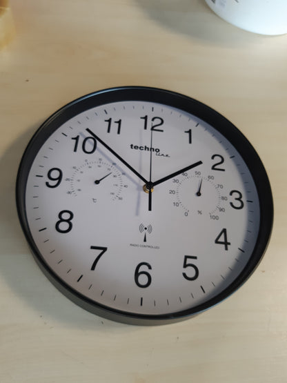 214715 - TECHNOLINE Orë muri me ekran të temperaturës dhe lagështisë, 30 cm, e zezë