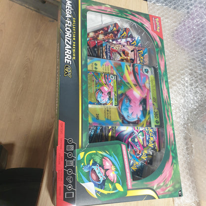 141529 - Pokémon – Mega Florizarre-ex Premium Collection, përfshin 1 kartë promo me shkëlqim, 1 kartë promo të madhe lentikulare dhe 8 paketa booster nga Pokémon TCG.
