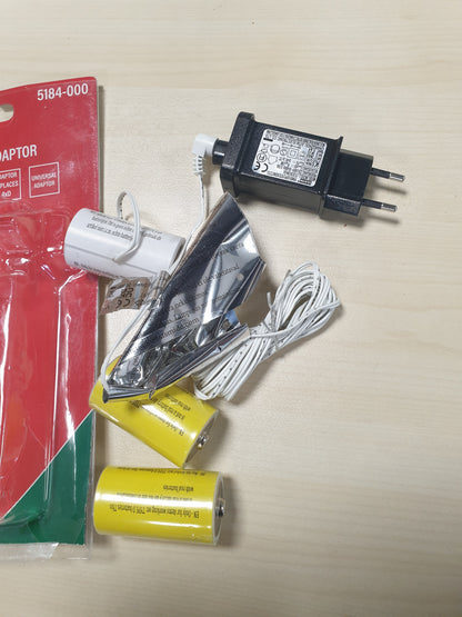 214980 - KONSTSMIDE Përshtatës rrjeti për pajisje me bateri, për ambiente të brendshme, me energji elektrike, 4x D