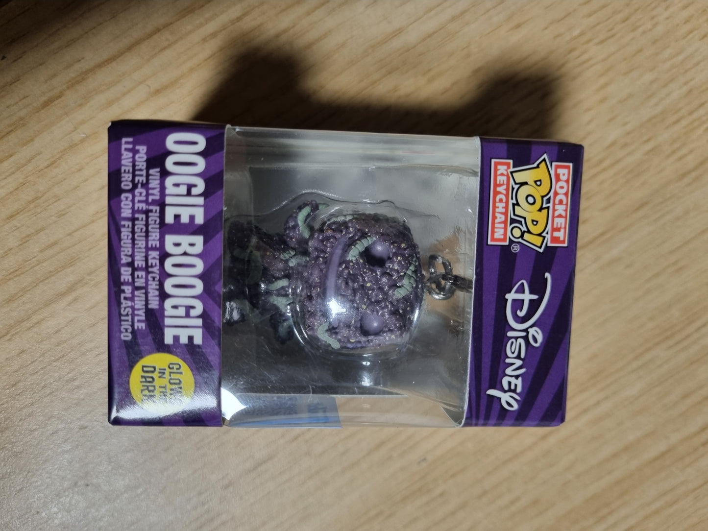 141614 - Funko Pop! llavero nga The Nightmare Before Christmas me Oogie (Bugs), që ndriçon në errësirë; mini figurë koleksionuese dhe dhuratë ideale për festat.
